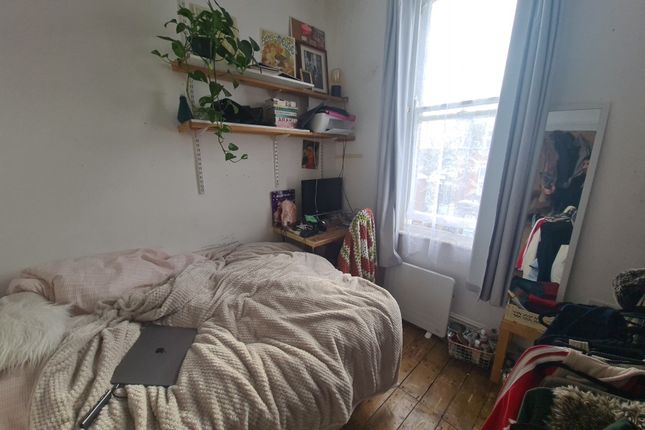 Cozy Single Bedroom Featuring A Comfortable Bed Wi...