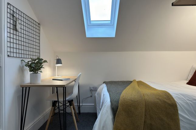 A Bright And Inviting Double Bedroom Featuring A S...