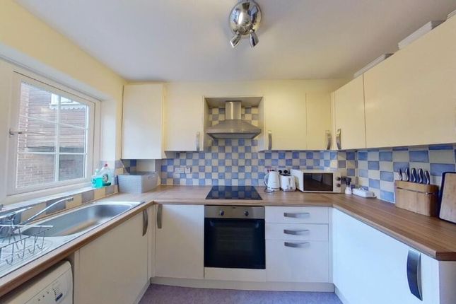 Bright And Tidy Kitchen Featuring A Spacious Count...