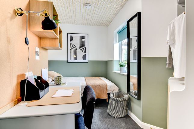 This Stylish Double Bedroom Features A Cozy Bed An...