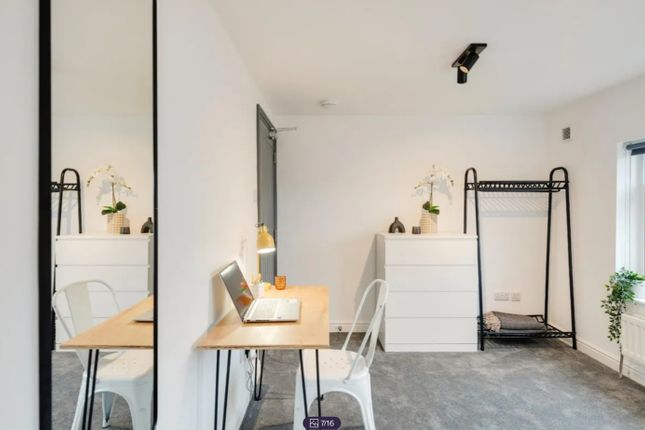 A Bright And Stylish Double Bedroom Featuring A Wo...