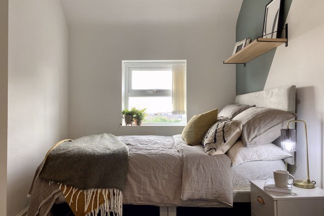 A Bright And Inviting Double Bedroom Featuring Coz...