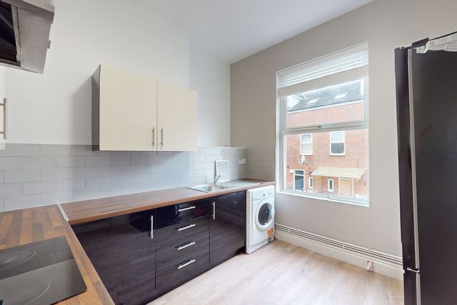 A Bright And Modern Kitchenette With Ample Counter...