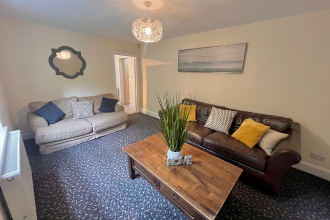 A Spacious And Inviting Living Room Perfect For So...