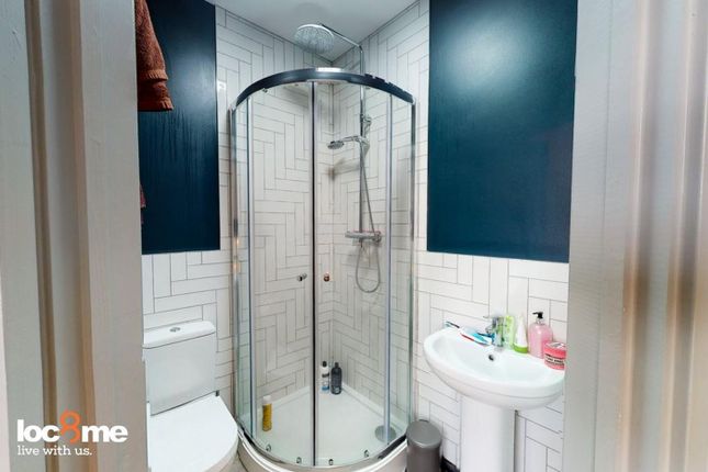 A Modern And Clean Bathroom Featuring A Stylish Sh...
