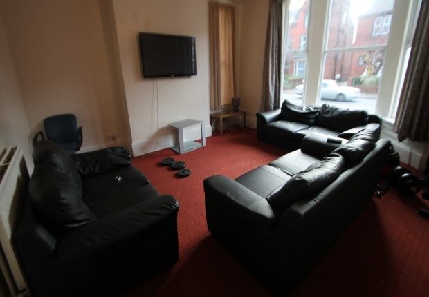 Spacious Communal Living Room With Multiple Comfor...