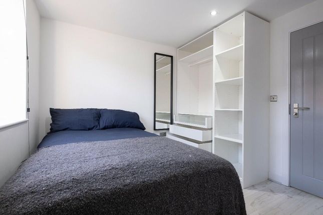 A Bright And Tidy Double Bedroom Featuring A Comfo...