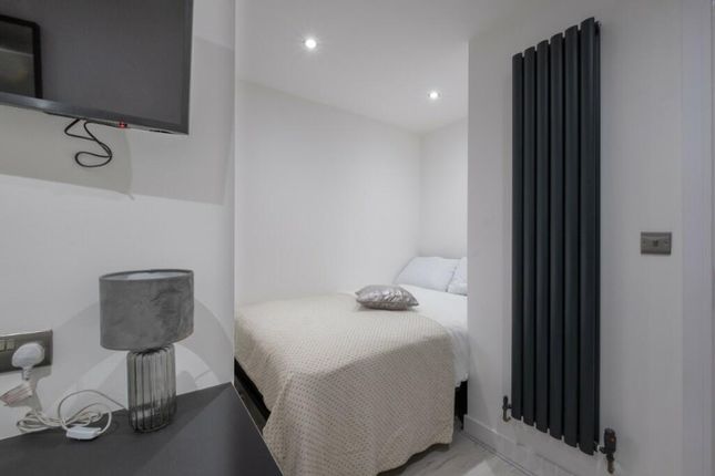 Cozy Double Bedroom Featuring A Comfortable Bed, S...