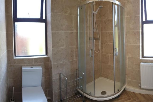 A Bright And Clean Bathroom Featuring Stone-Tiled ...