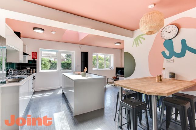 Bright, Contemporary Open-Plan Kitchen With A Cent...