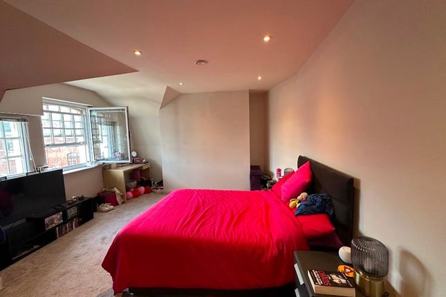 A Spacious Master Bedroom Featuring A Large Double...
