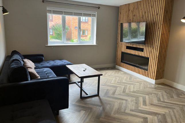 A Modern Living Room Featuring A Large Window Prov...