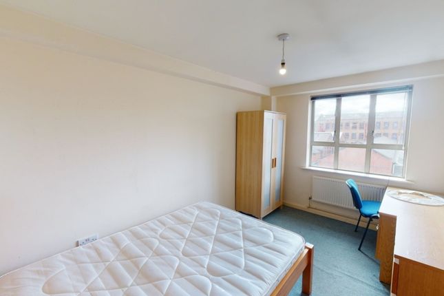 A Bright Double Bedroom Featuring A Large Window T...