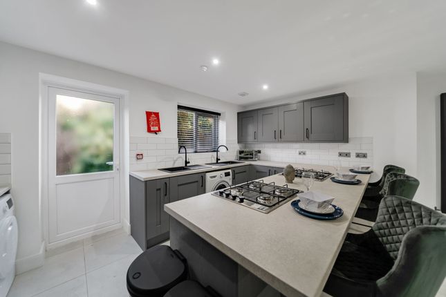 Modern And Well-Maintained Kitchen Featuring Sleek...