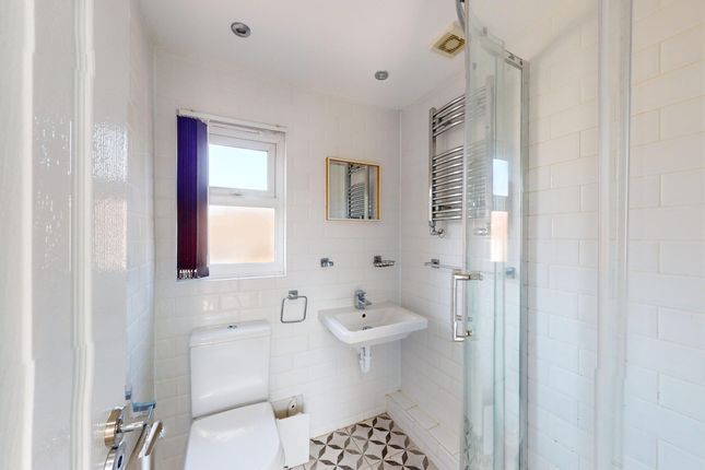 A Bright And Modern Bathroom Featuring A Stylish S...