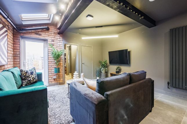 A Stylish Contemporary Living Room With Exposed Br...