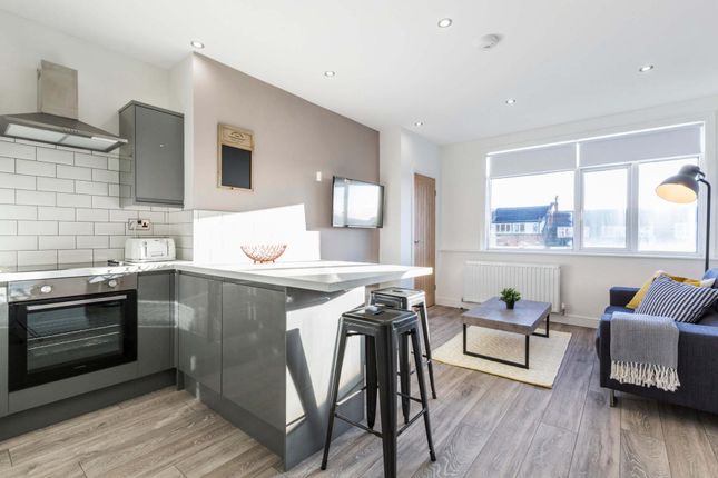 Bright, Modern Open-Plan Living Space With A Conte...