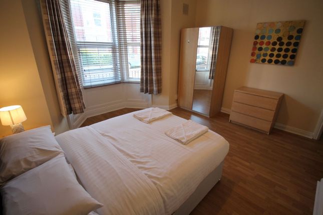 This Inviting Double Bedroom Features Ample Natura...