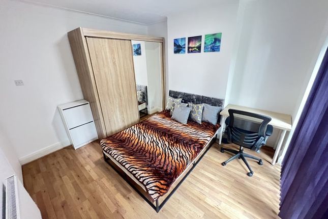 A Bright, Well-Kept Double Bedroom Featuring A Sty...