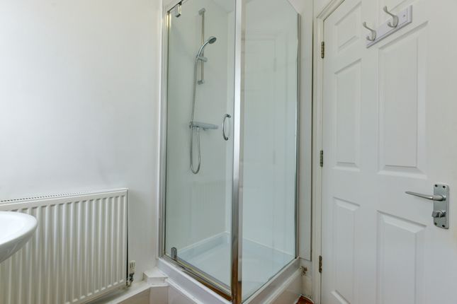 A Clean And Modern Bathroom Featuring A Spacious S...