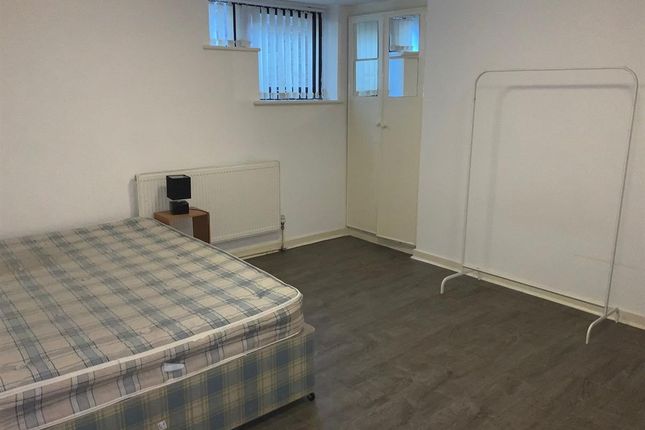 A Simple Double Bedroom With A Large Mattress, Neu...