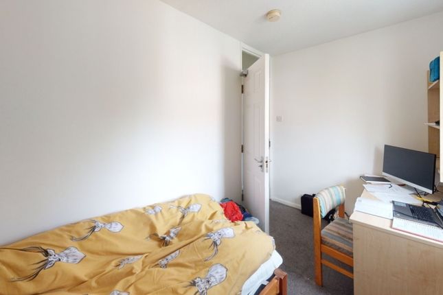 A Compact Single Bedroom Featuring A Cozy Single B...