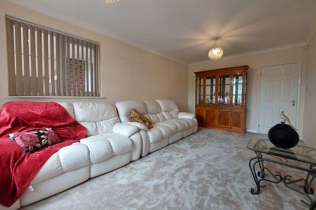 A Spacious And Well-Maintained Living Room Featuri...