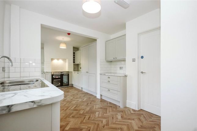 A Modern And Well-Designed Kitchen Featuring Ample...