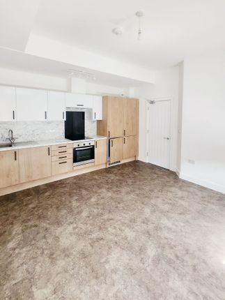 Bright, Modern Open-Plan Kitchen With Light Wood c...