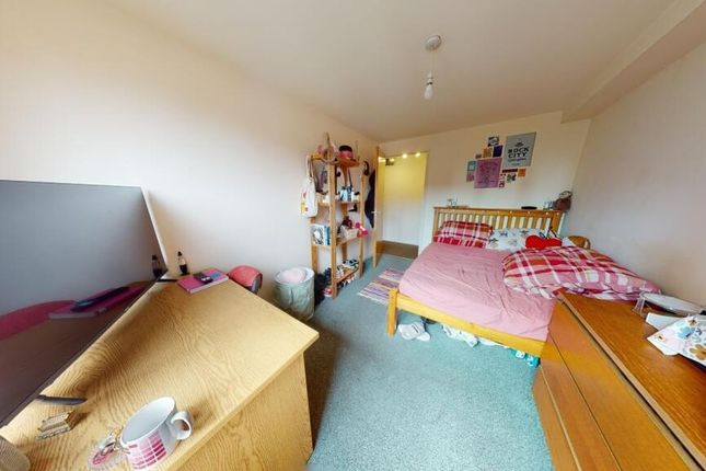A Cozy And Functional Single Bedroom Featuring A B...