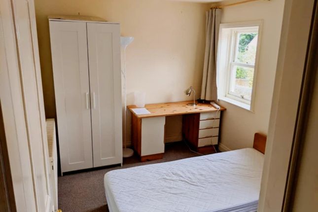 A Bright And Tidy Double Bedroom With Ample Natura...