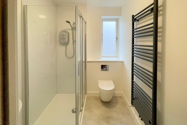 A Modern Bathroom Featuring A Sleek Glass Shower, ...