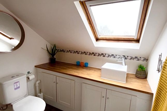 A Beautifully Designed Bathroom Featuring A Stylis...
