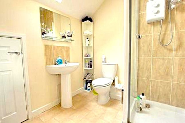 A Clean And Bright Bathroom Featuring Modern Fixtu...