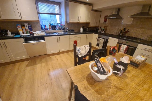 Bright And Functional Kitchen Featuring Modern Cab...