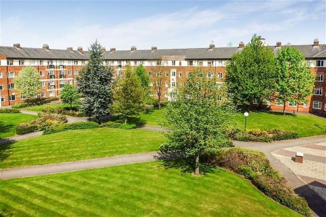 A Beautifully Maintained Communal Garden Area Surr...