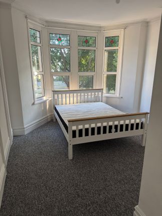 Bright And Inviting Double Bedroom Featuring A Lar...