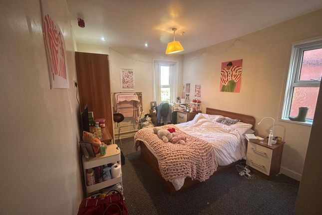 A Cozy And Well-Maintained Bedroom With Natural li...