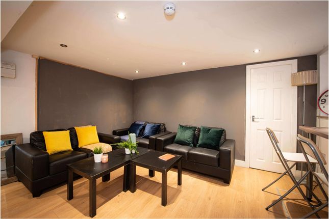 A Spacious, Well-Maintained Living Room Featuring ...