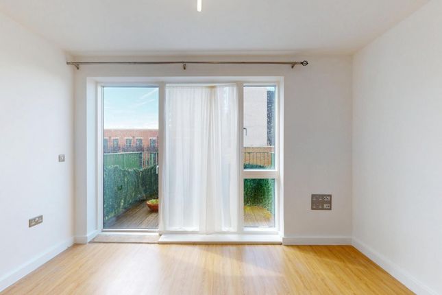 Bright And Airy Living Room Featuring Large Glass ...