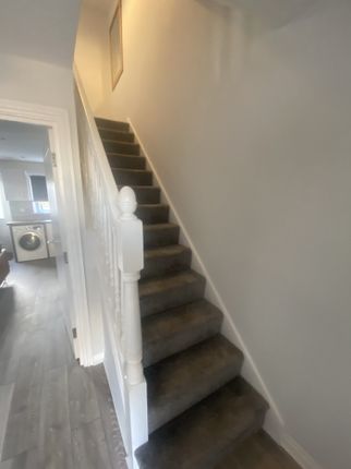 A Well-Maintained Staircase Leading To The Upper l...