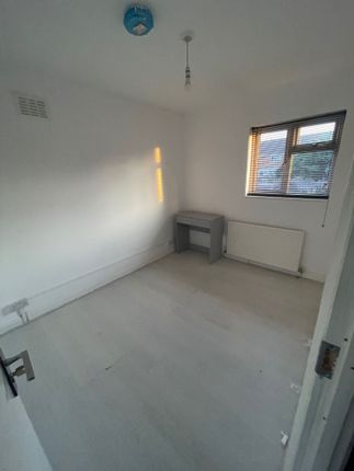 A Bright, Simple Single Bedroom With White Walls A...