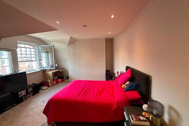 A Spacious And Inviting Master Bedroom Featuring A...