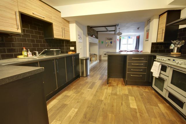 A Spacious And Modern Kitchenette With Ample Stora...