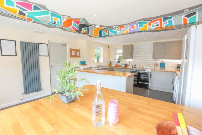 Bright And Modern Kitchen Featuring Ample Counter ...