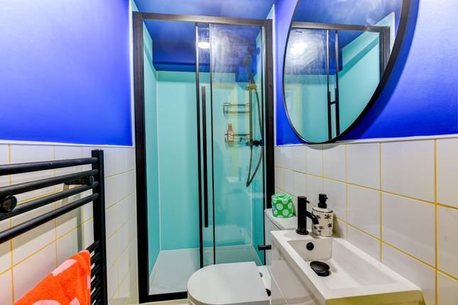 Modern Bathroom Featuring A Sleek Shower Enclosure...