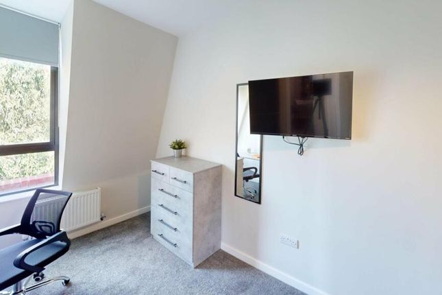 A Bright And Tidy Double Bedroom Featuring Modern ...