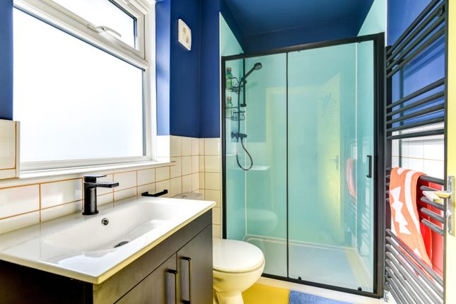 Bright And Modern Bathroom Featuring A Frosted Win...