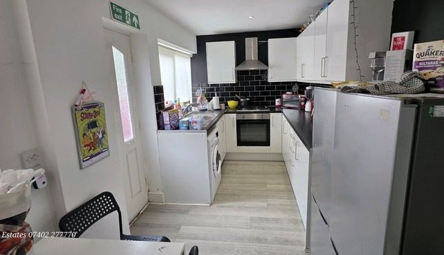 Bright And Modern Kitchen With Sleek White Cabinet...