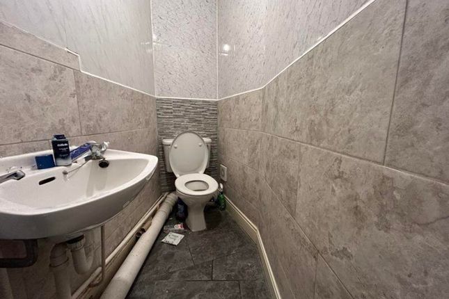A Compact Single Toilet Featuring Modern Finishes,...